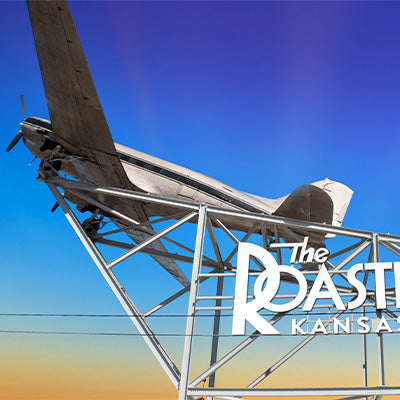 Image of a DC-3 plane placed on top of the Roasterie Kansas City's room.