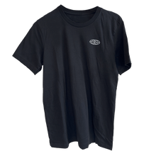 Load image into Gallery viewer, TRC Shirt in classic black featuring a small globe badge design on the chest. Made from stretch-fit fabric with a clean, minimalist aesthetic and comfortable crew neck cut.
