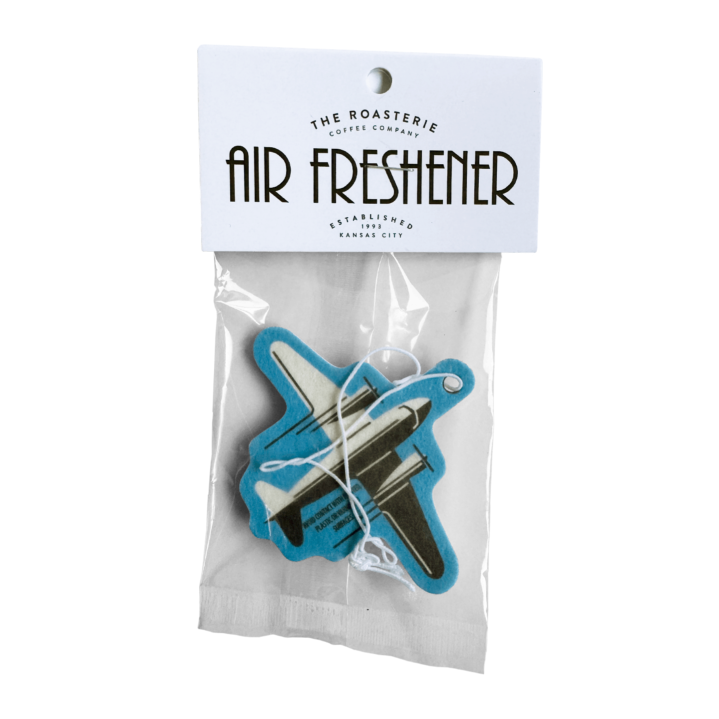 DC-3 Air Freshener with vanilla scent shaped like a vintage airplane hanging inside packaging from The Roasterie.