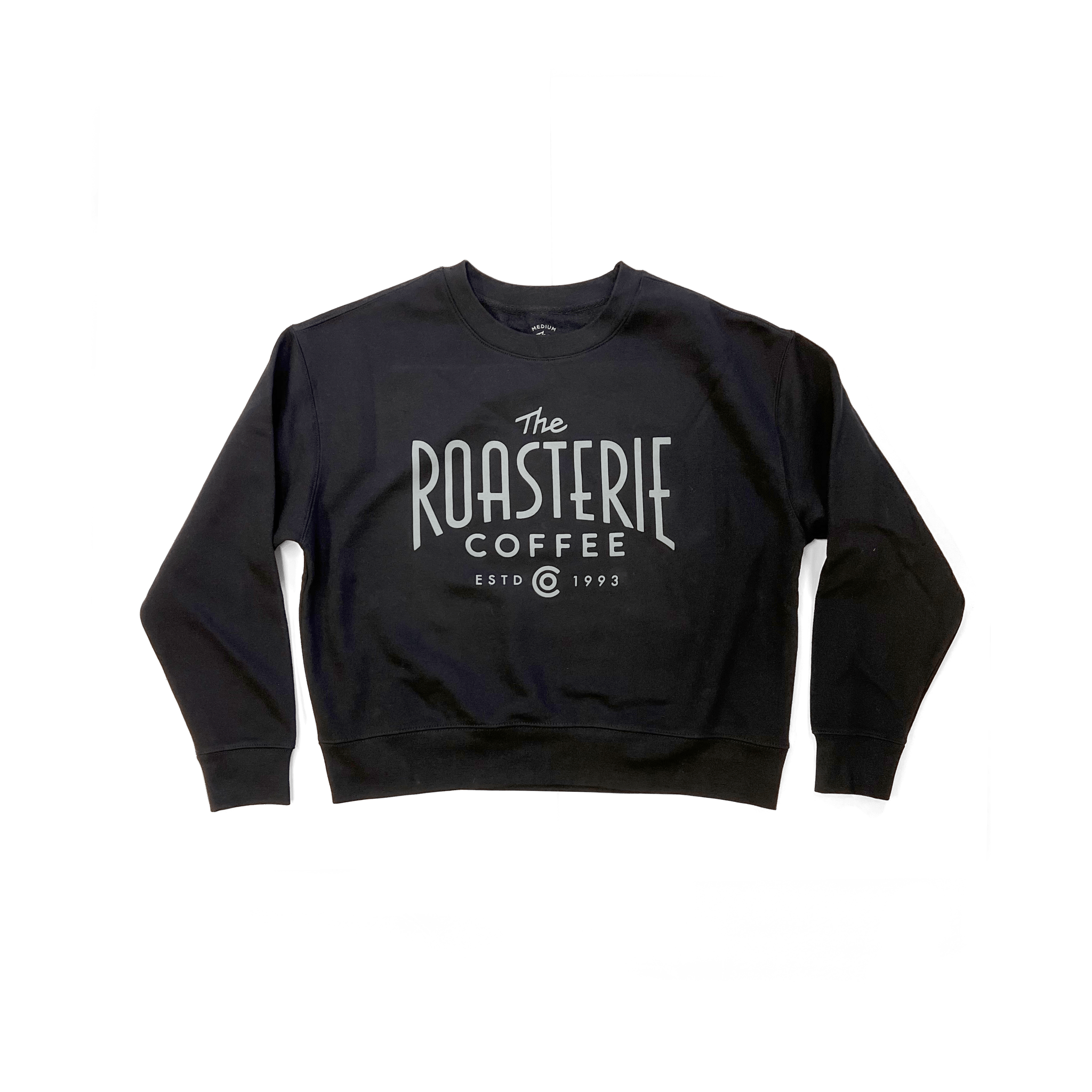 Black cropped crewneck sweatshirt with The Roasterie Coffee logo printed on front, cozy fleece material.