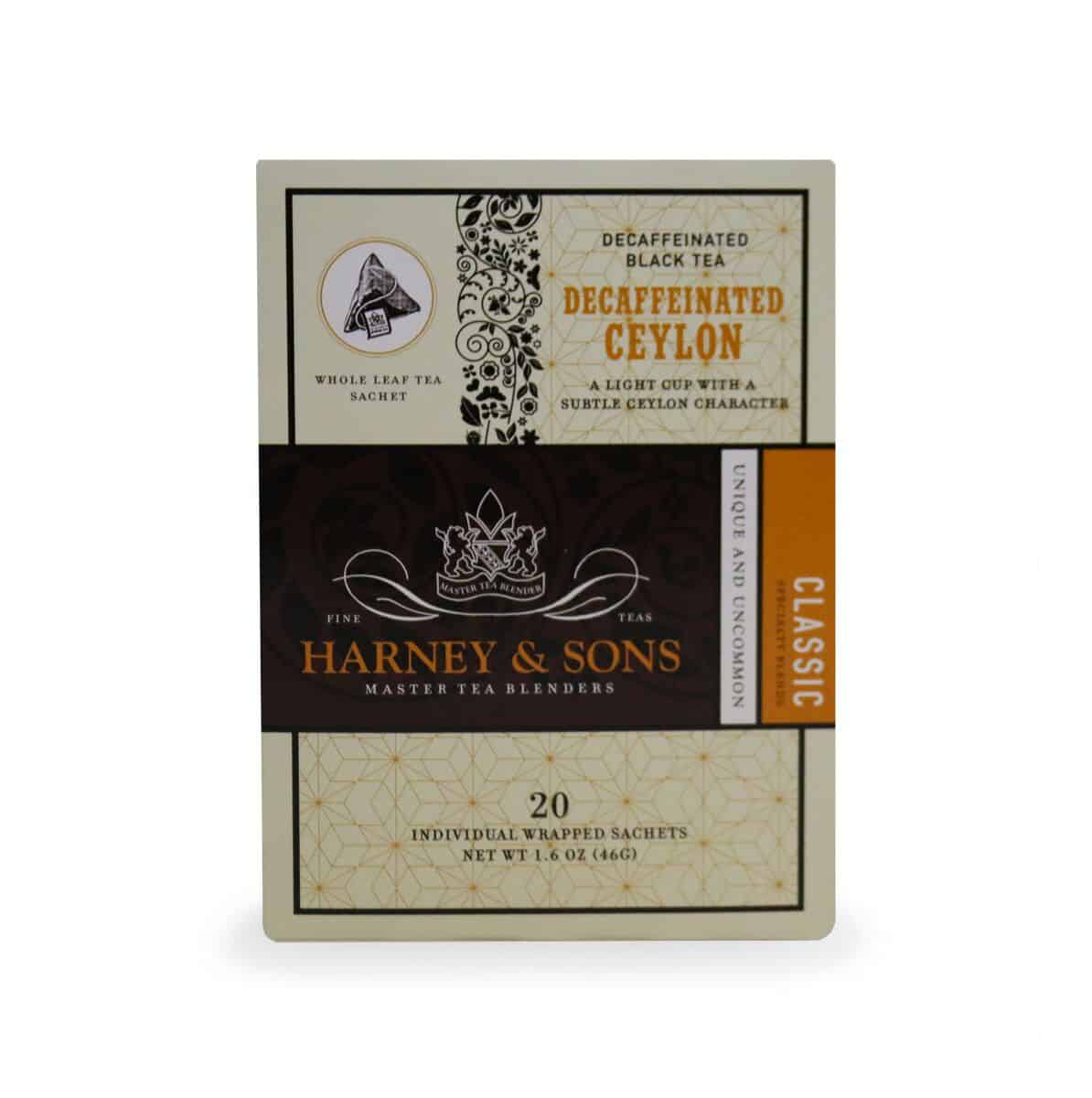 Harney & Sons Decaffeinated Ceylon Tea box containing 20 individually wrapped sachets, featuring elegant black and gold packaging with ornate floral designs, brand logo and classic labeling on a cream-colored background