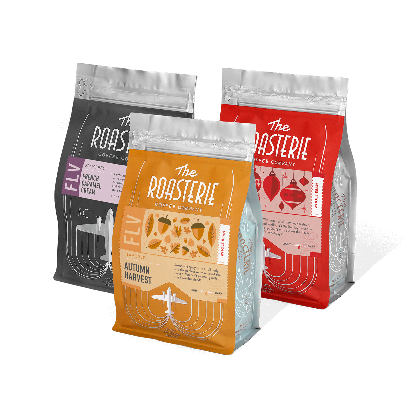Three premium coffee bags from The Roasterie Coffee Company's Flavors of the Season Bundle, featuring colorful packaging in red, orange, and black, arranged to showcase seasonal coffee blends in resealable 12-ounce bags.