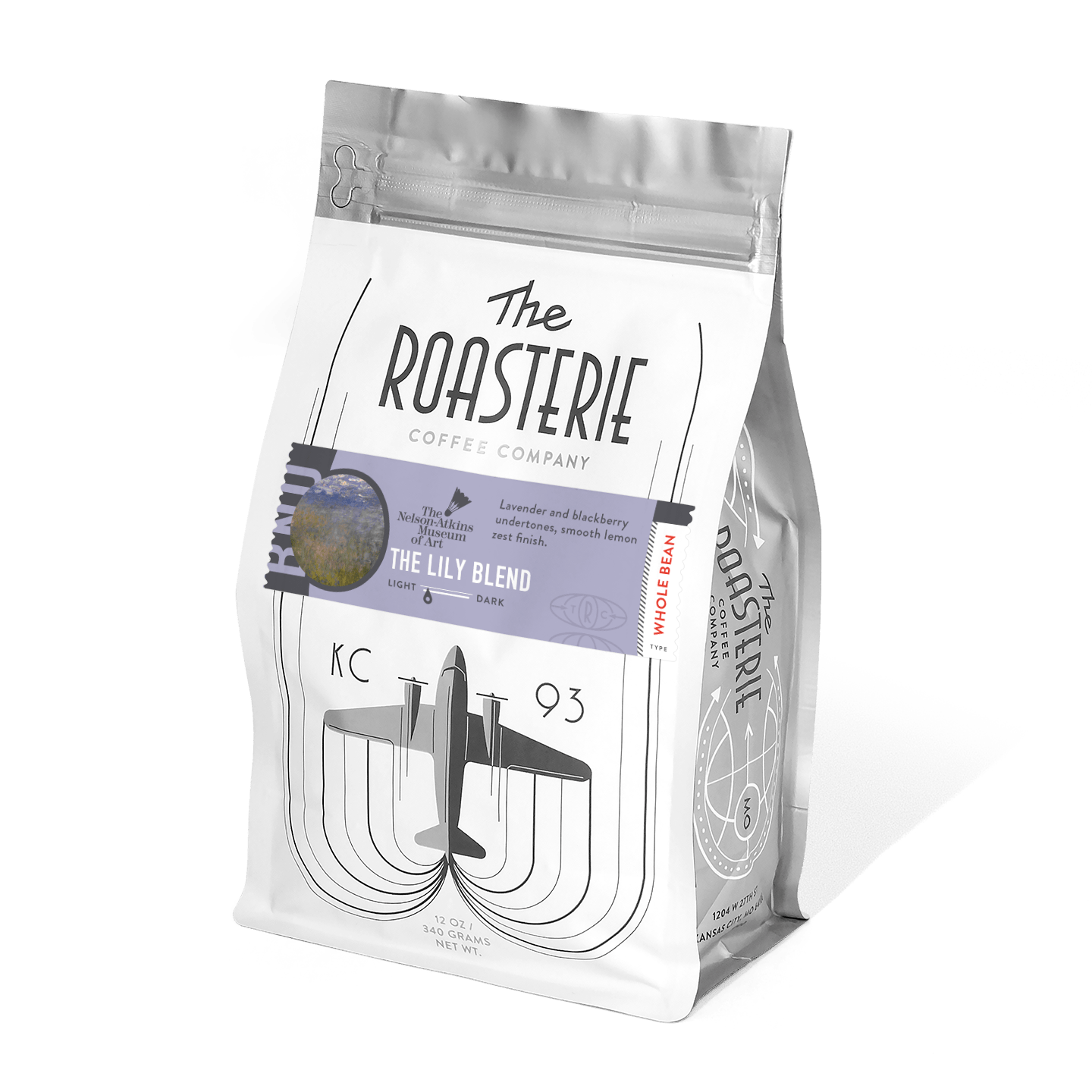 The Lily Blend coffee bag from The Roasterie featuring a white resealable package with purple accent band, aircraft logo design, and artistic water lily motif inspired by Monet's masterpiece. Limited edition collaboration blend with lavender and blackberry notes.