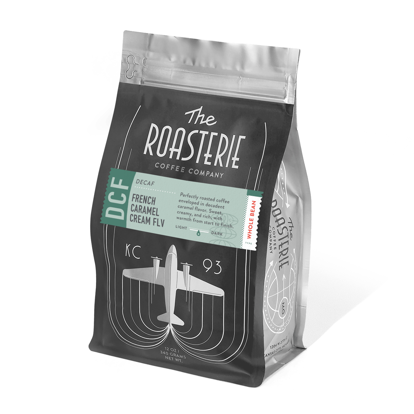 A black coffee bag of French Caramel Cream Decaf by The Roasterie featuring an art deco-style airplane design and mint green label, showcasing their signature KC 93 branding on premium decaffeinated coffee packaging.