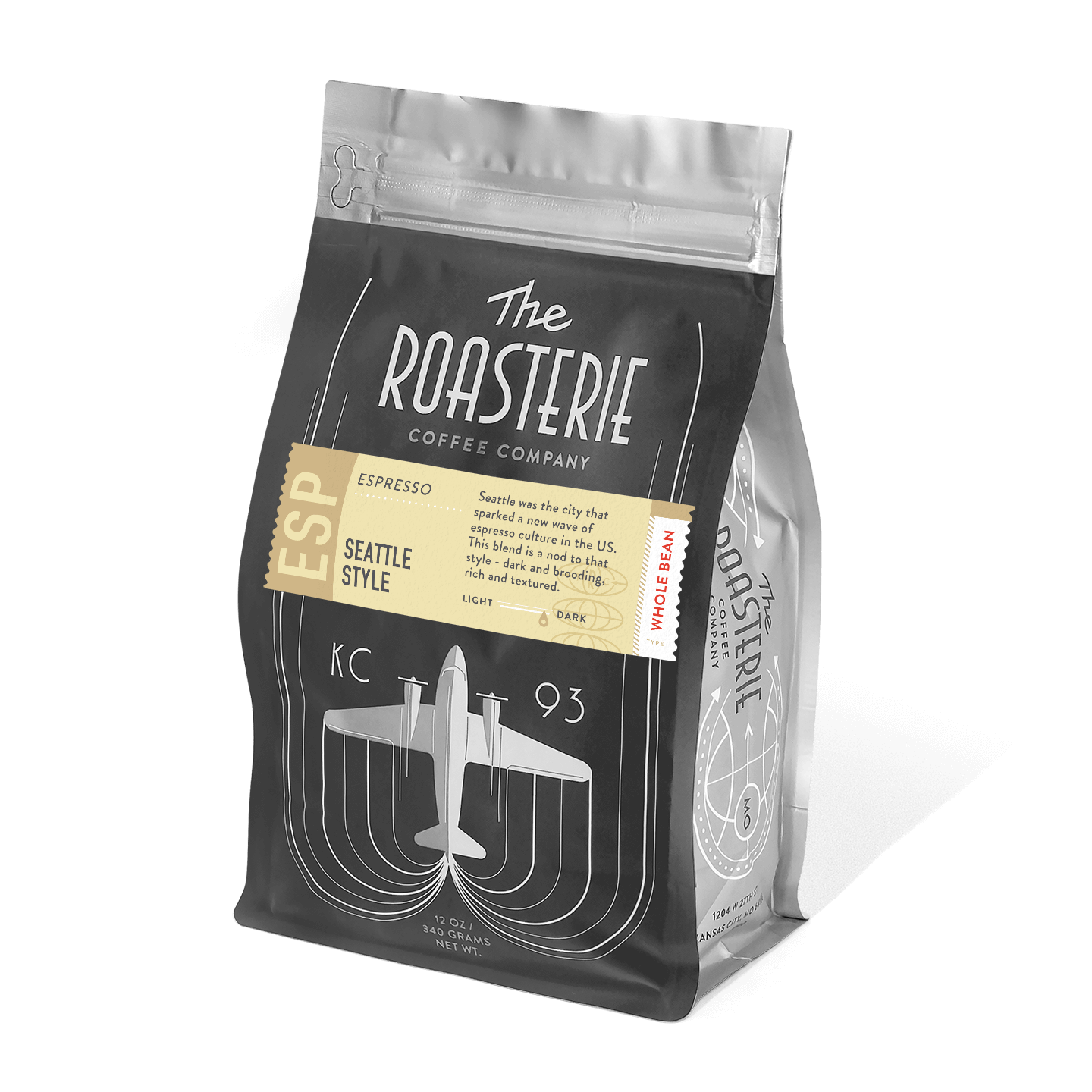 Seattle Style Espresso coffee bag from The Roasterie featuring a vintage-inspired black and silver design with an airplane motif and art deco curves. Dark roasted coffee blend packaged in a resealable silver and black bag with retro typography and branding elements.